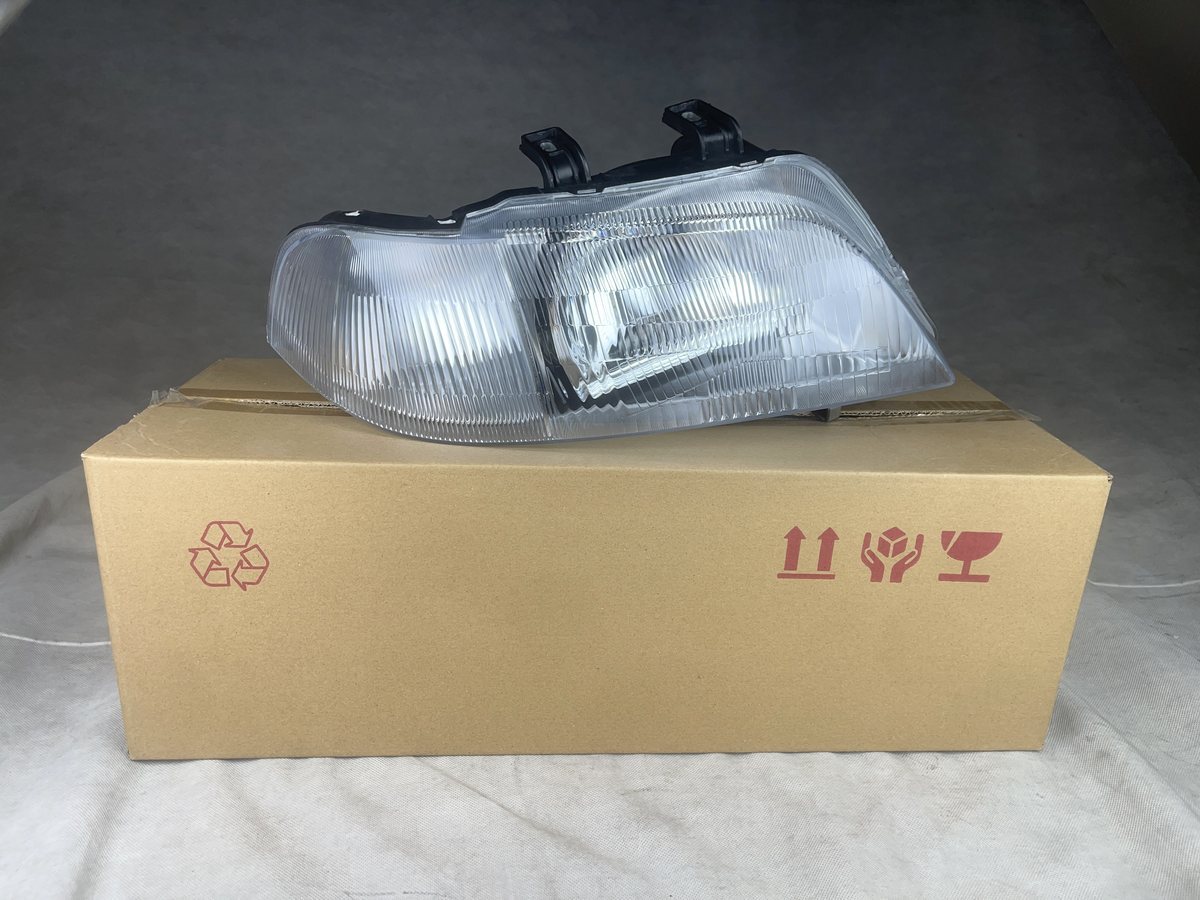 Budget aftermarket headlight with its box